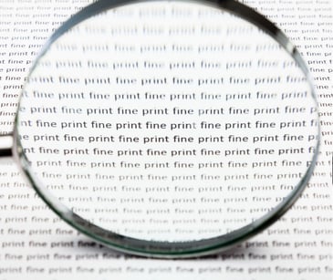 magnifying glass over text fine print