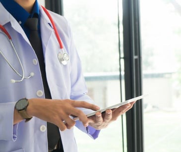 provider holding tablet