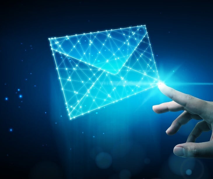 Image of someone tapping a large email icon. 
