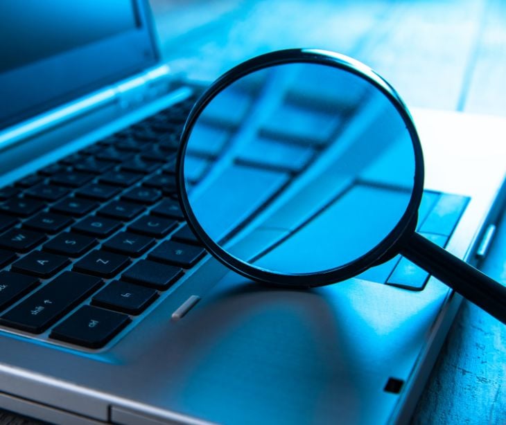 magnifying glass on laptop