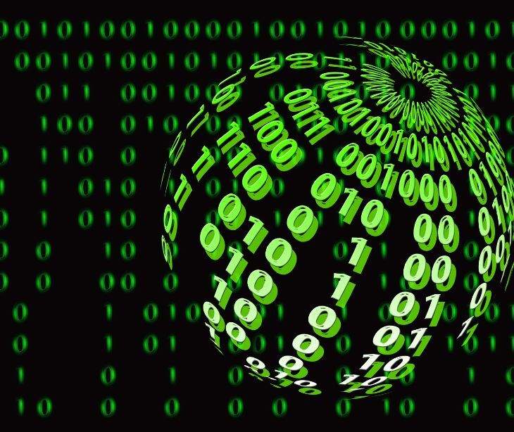 Image of a glowing ball with numbers on it in green. 