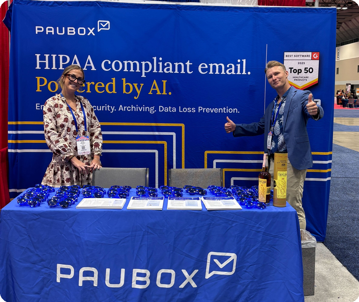 Two people at the Paubox booth in the NCPA Annual Convention expo hall | NCPA Annual Convention 2026 in Kansas City