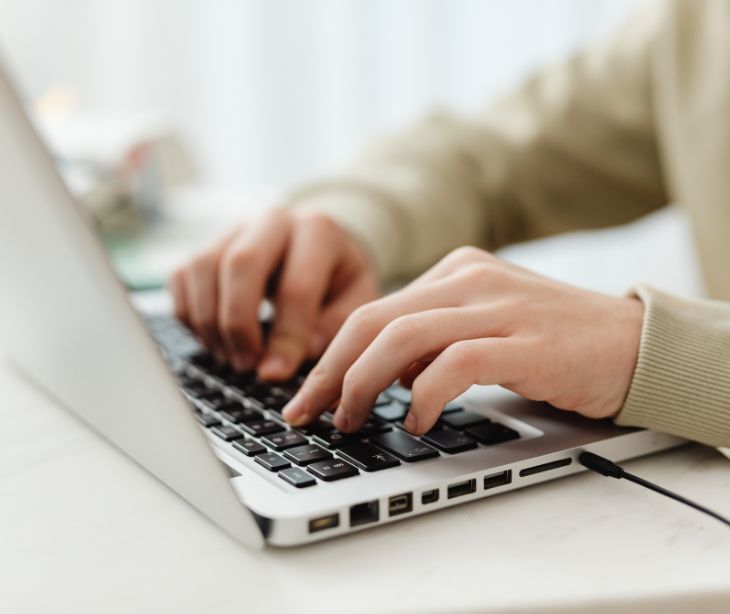 Image of someone on a computer. 