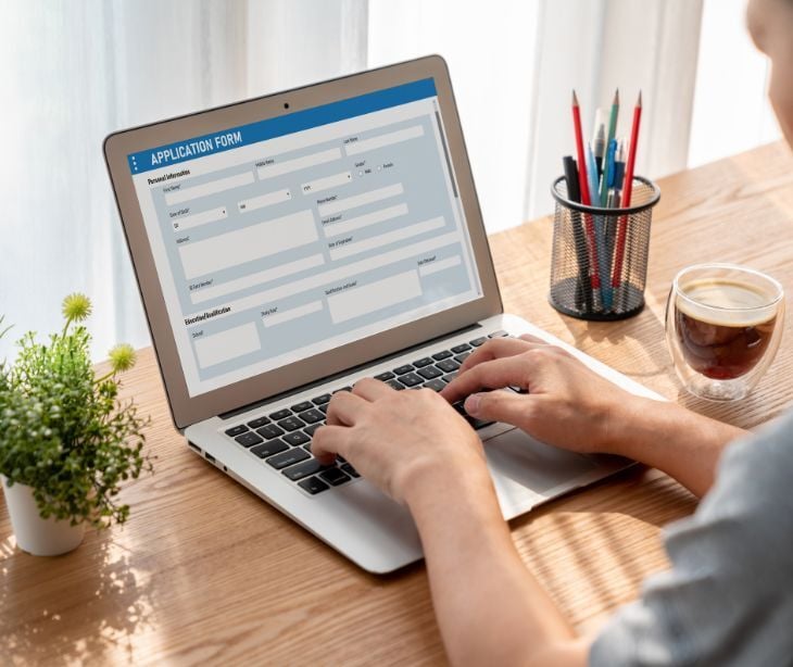 Image of someone filling out an online form. 