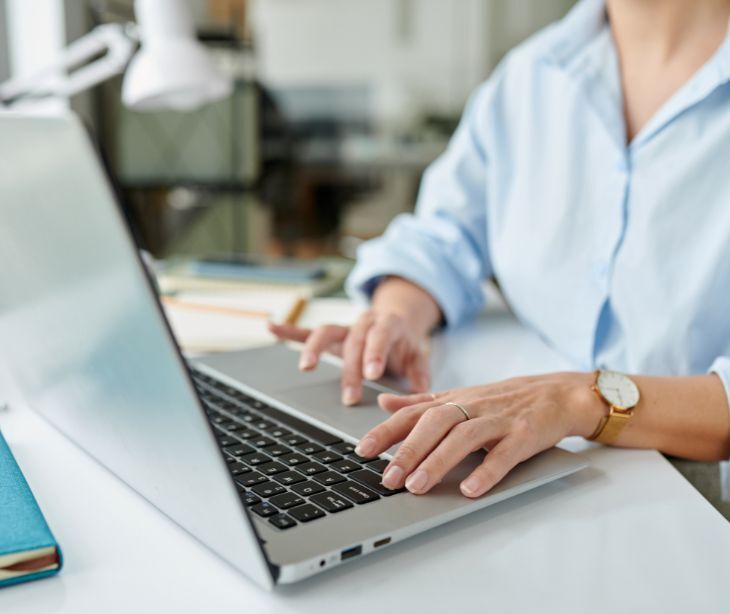 Image of someone on a laptop. 