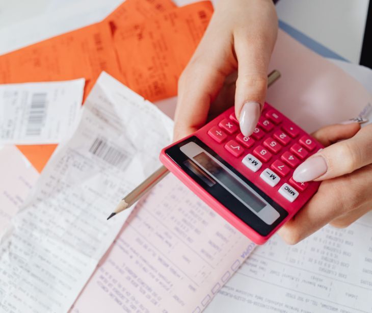 Image of someone using a calculator. 