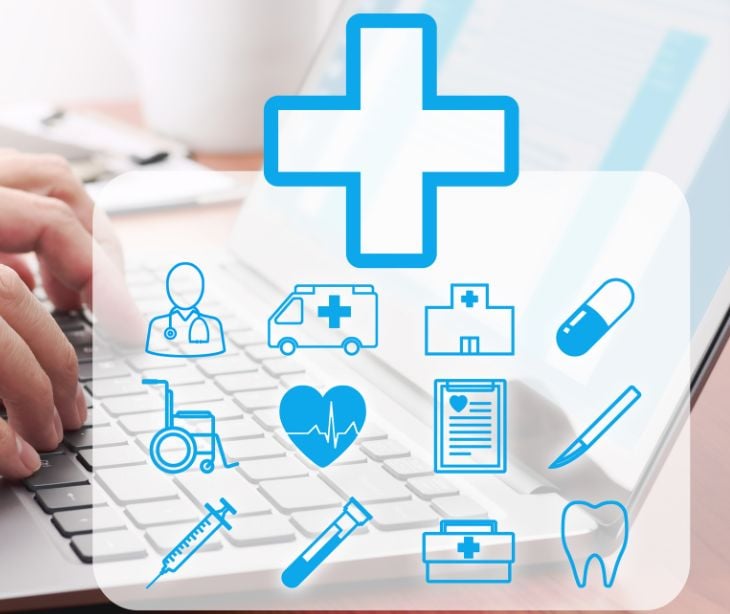 floating health insurance icons over a keyboard