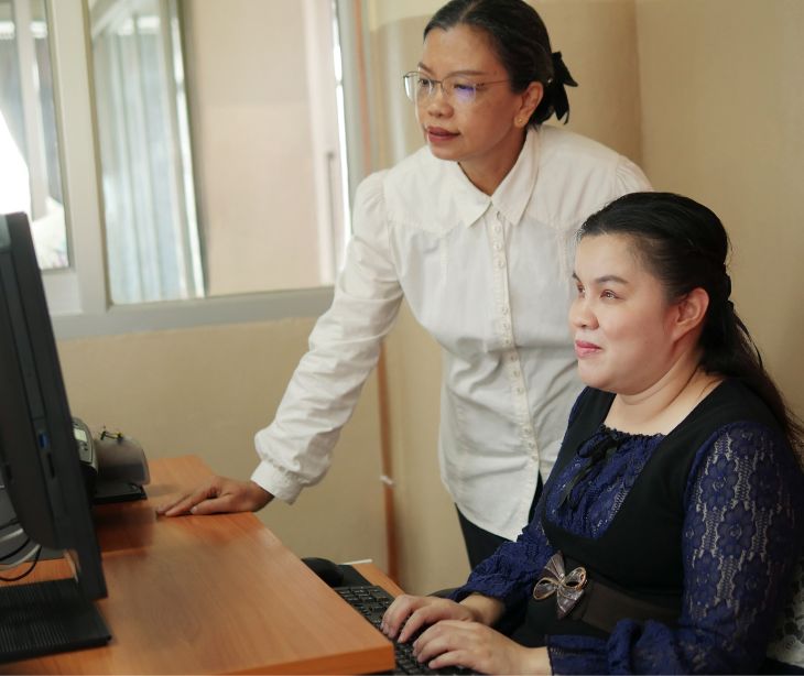 visually impaired woman at screenreader