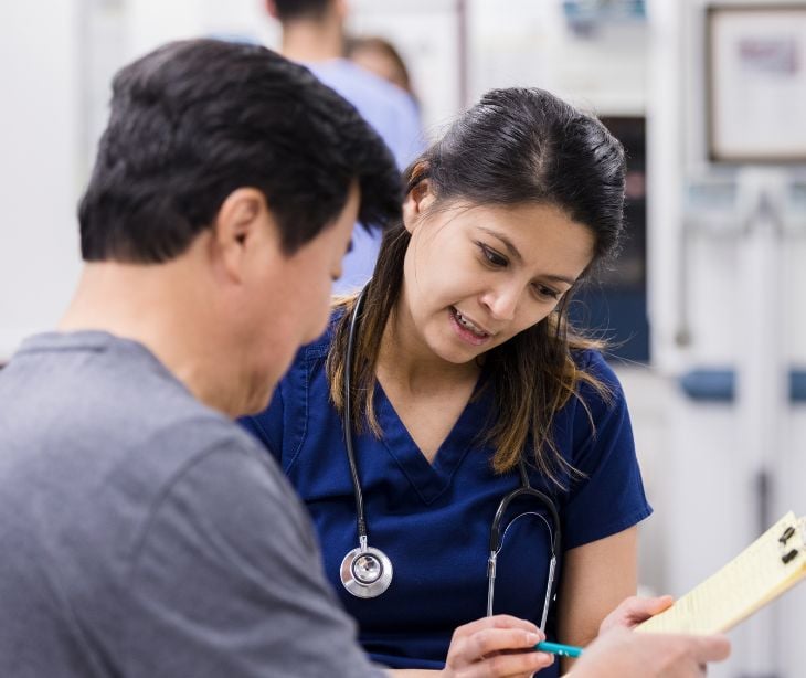 nurse getting a signature from patient