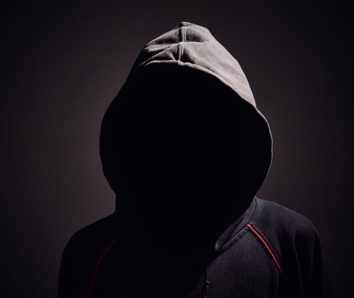 Image of a hooded figure. 
