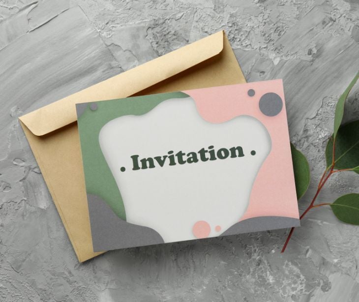 Image of a card that says "invitation." 