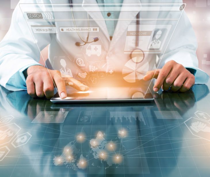 healthcare provider on a laptop with floating marketing icons
