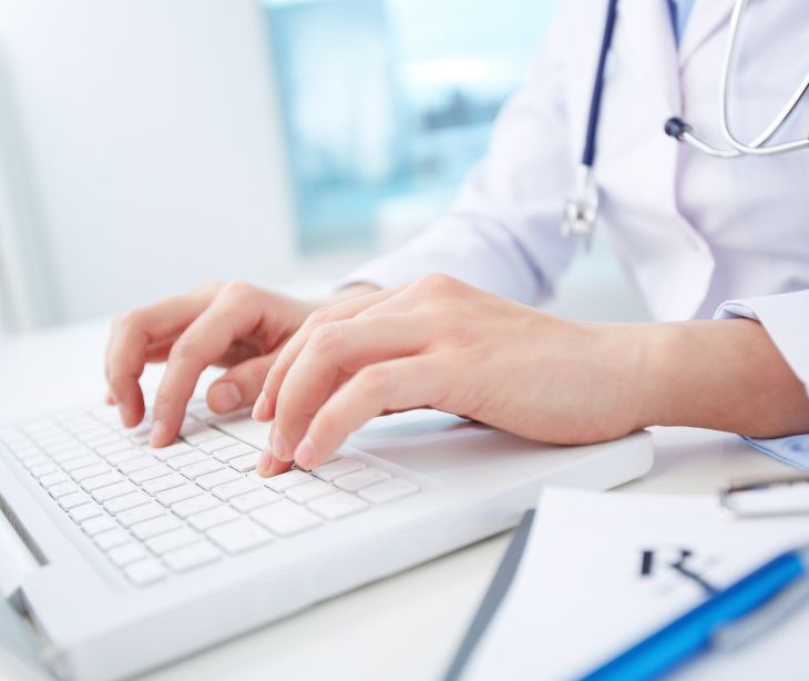 healthcare provider at computer