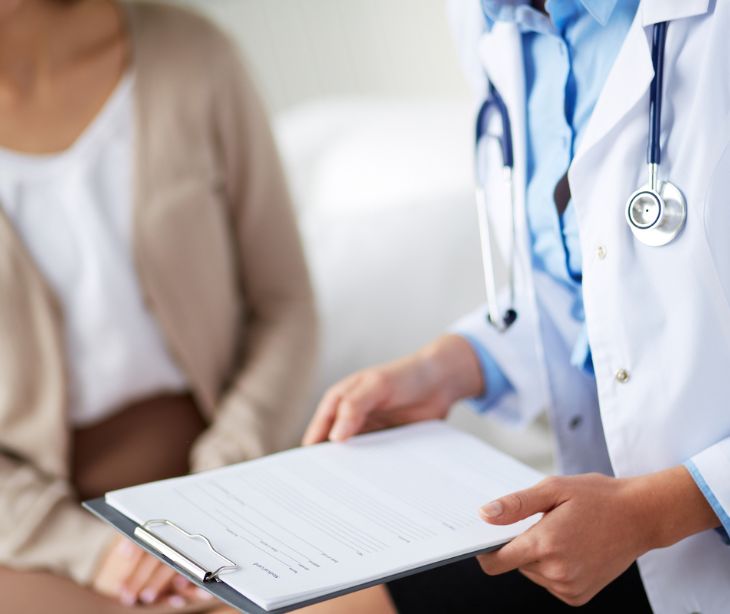 medical professional holding clipboard