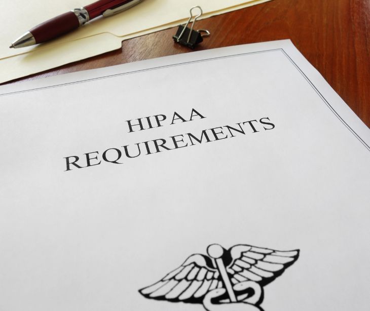 HIPPA requirements paper on desk