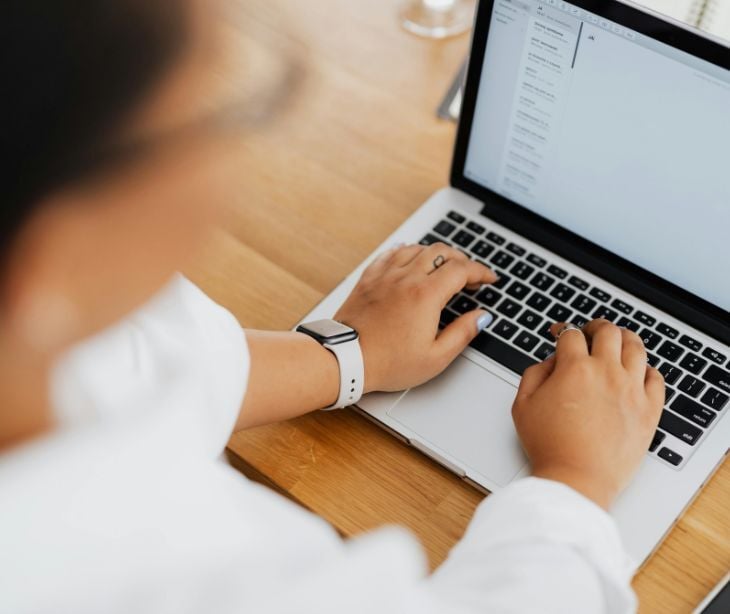 Image of someone typing on a computer. 
