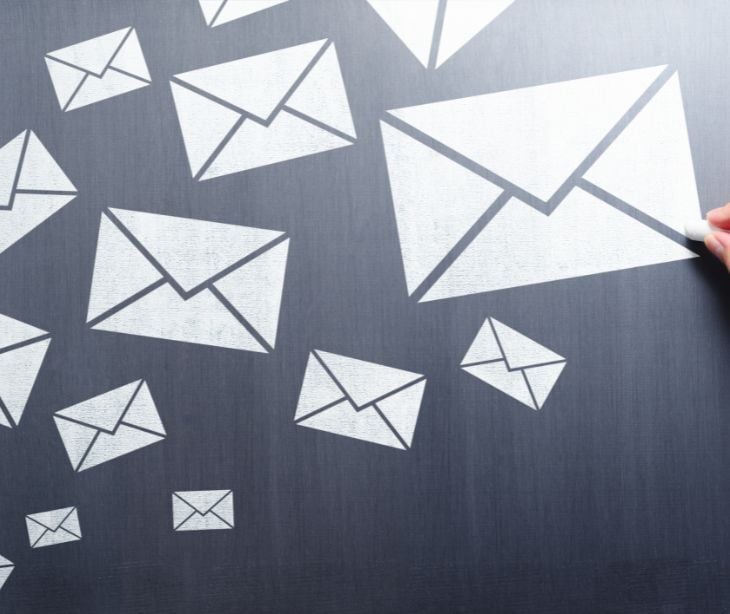Image of email icons on a blackboard. 