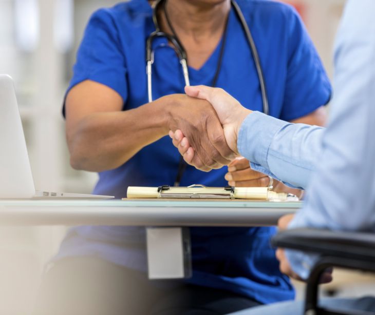 provider and patient shaking hands