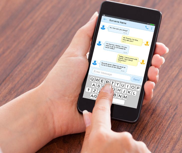 hand text messaging on smartphone