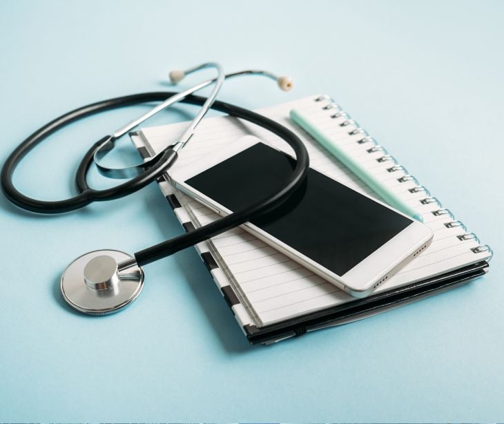 cellphone with notepad and stethoscope