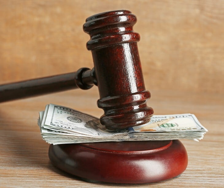 Image of a gavel and money. 