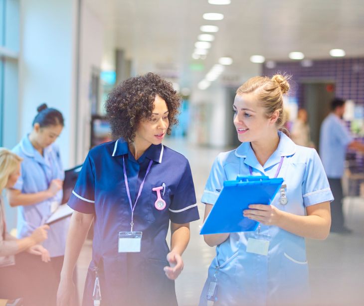 nurses talking in a hospital environment
