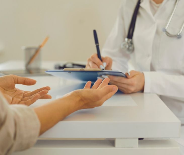 Image of a doctor talking to a patient. 