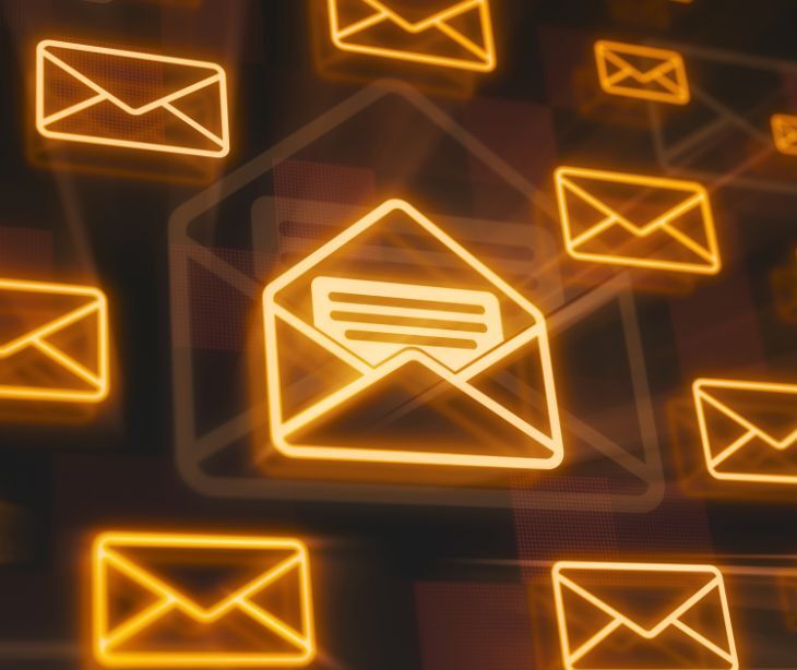 Image of neon orange email icons. 