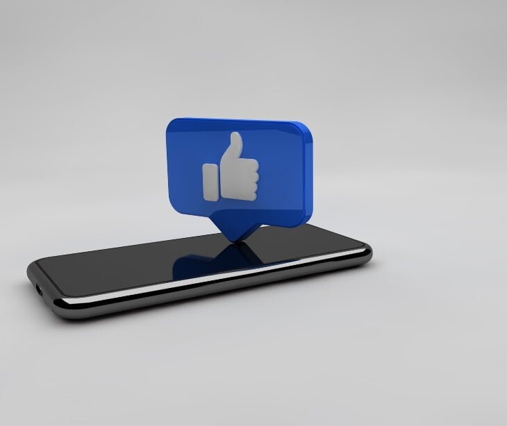 Image of a phone with a thumbs up icon. 