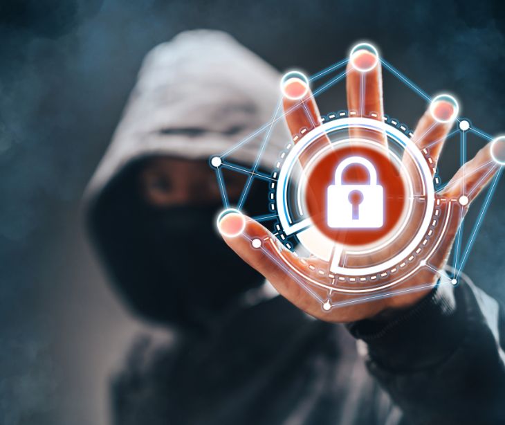 hacker in black hoodie hand up with a red lock symbol
