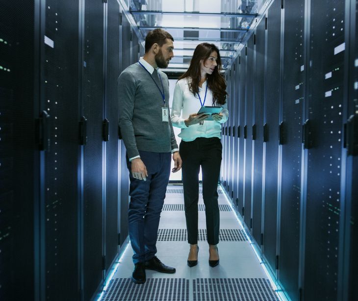 employees standing in a data center