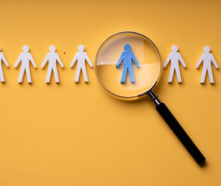 people icons with magnifying glass