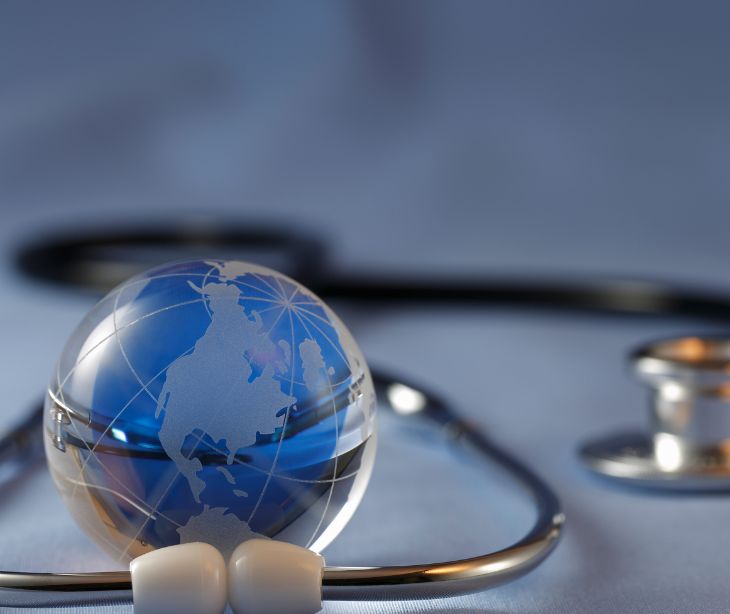 globe surrounded by stethoscope