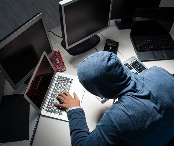 Image of an individual on a laptop. 
