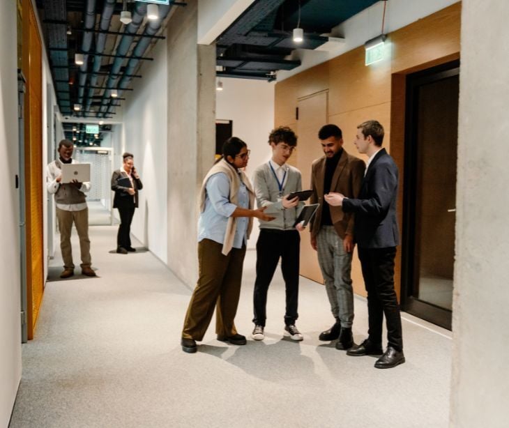 Image of people talking in a small group. 