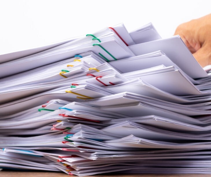 Image of a stack of paperwork. 
