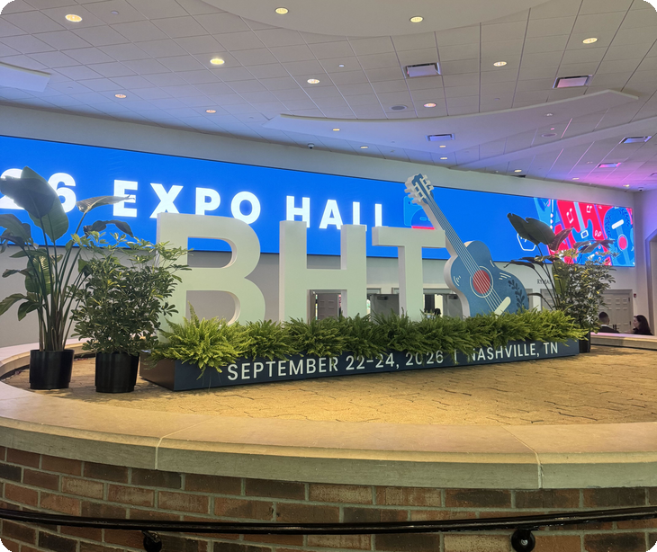The Behavioral Health Tech 2026 sign with a blue guitar sculpture outside the expo hall at Gaylord Opryland in Nashville | Paubox at Behavioral Health Tech 2026 in Nashville
