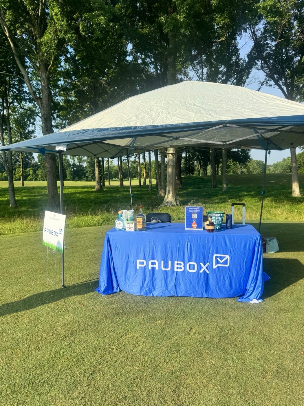 Paubox hole sponsor tent and table at Hermitage Golf Course.