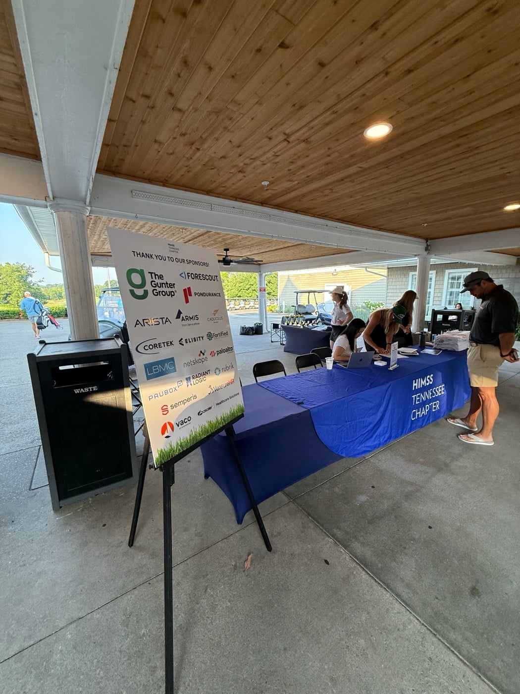 HIMSS Tennessee Chapter registration table and sponsor sign.